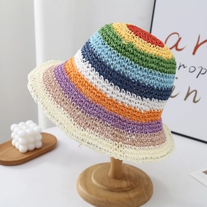 Detail of colorful rainbow striped hand-woven straw sun hat for summer beach protection
