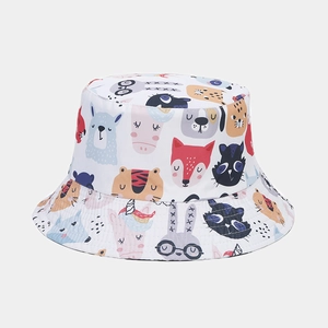 Close-up of double-sided fisherman hat with colorful cartoon animal print on white fabric