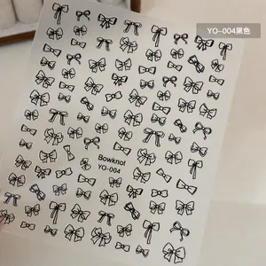 Detail of YO-004 black bowknot nail stickers with elegant hand-drawn patterns