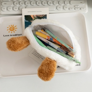 Interior view showing large capacity storage for pens in the plush dog pencil case