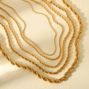 Detailed view of gold twisted cable chain necklaces in various thicknesses and sizes