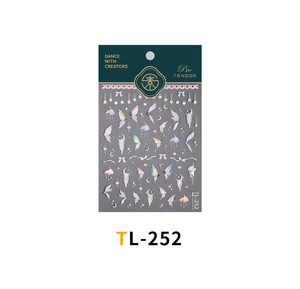Detail of TL-252 holographic butterfly and star nail stickers with metallic gold accents