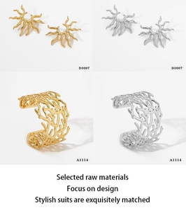 Detail view of gold and silver sun-shaped earrings and irregular textured ring set