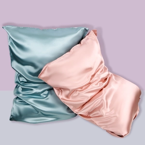 Lustrous 22 Momme Mulberry silk pillowcases in blue and pink with a sleek envelope closure