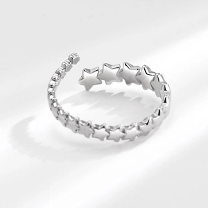 Minimalist silver pentagram star ring with vintage aesthetic on a clean white background