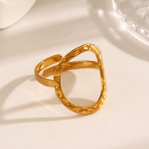 Adjustable gold hammered open ring with irregular hollow oval design on white surface