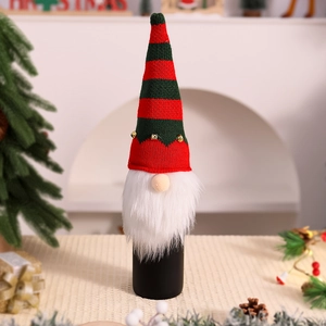 Detail of Christmas gnome wine bottle cover with striped knit hat and faux fur beard
