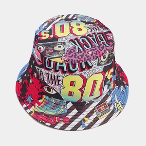 Detail of retro graffiti bucket hat with 80s boombox and roller skate patterns