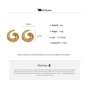 Detailed view of gold spiral swirl earrings with size specs and material info