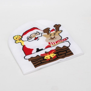 Detail of white Christmas knit beanie with colorful Santa, reindeer and gingerbread patterns