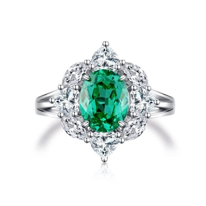 S925 silver ring with oval green stone and marquise-cut white gems in floral design