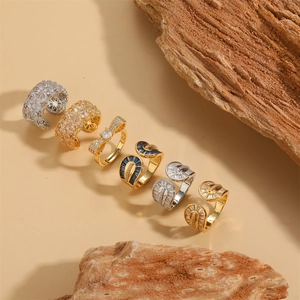 Luxurious 14k gold plated ring set with zircon accents on a natural wood display