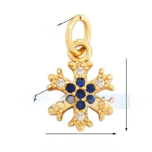Detail view showing a 9mm gold-plated snowflake pendant with blue and white zircon stones