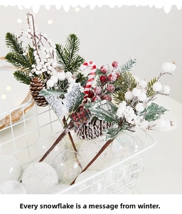 Macro detail of snowy Christmas pine picks with red berries, pinecones and candy canes