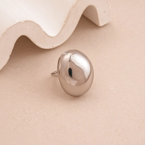 Detailed view of a polished silver oval bean ring with a smooth mirror finish