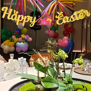 Golden glitter Happy Easter banner with pink bunny cutouts for party festive decoration