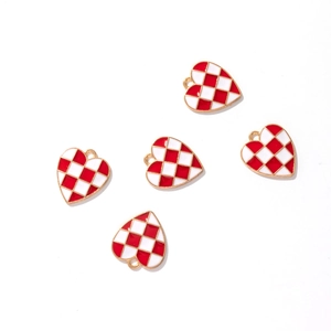 Five heart-shaped red and white checkered enamel pendants with gold metal edges