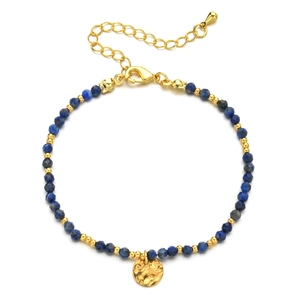 Detail of blue faceted natural stones with gold coin charm and stainless steel beads