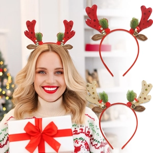 Detailed view of Christmas glitter reindeer antler headbands with bells and pine needles