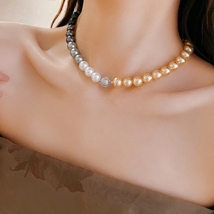 Close-up of elegant French vintage pearl necklace with diamond-encrusted magnetic clasp