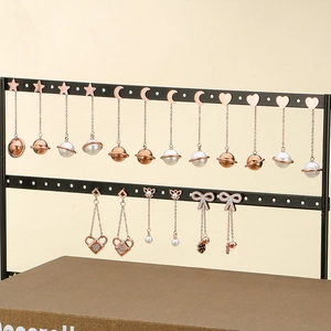 Elegant rose gold tassel earrings with pearls, star, moon, and heart charms for women