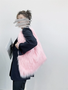 Detailed view of large pink faux fur tote bag with plush texture and Y2K aesthetic