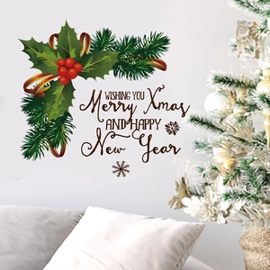 Christmas wall decal showing green holly leaves, red berries, and holiday greetings on a wall
