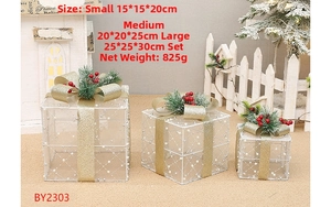 Three-piece set of white flocked Christmas gift boxes with golden ribbons and pine accents
