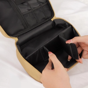 Portable PU champagne makeup bag with adjustable dividers and large storage capacity
