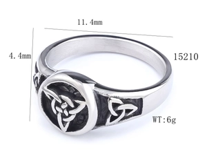 Detail view of vintage Viking rune ring with Celtic knots and oxidized steel finish