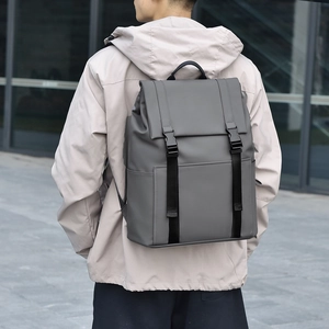 Minimalist dark grey commuter laptop backpack for men featuring modern flap design