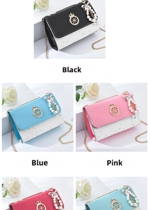 Detail of crossbody bag chain with pearl tassel pendant and crown buckle in various colors