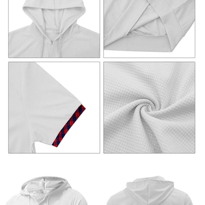 Detail of waffle knit fabric and red-blue plaid trim on white hooded t-shirt