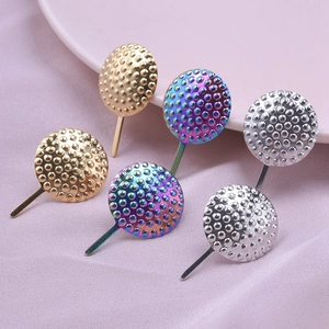 Close-up of geometric bubble textured 304 stainless steel earrings in gold, silver, and rainbow