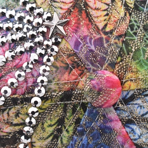 Macro view of floral baseball cap crown with silver rhinestones and star metallic ornament