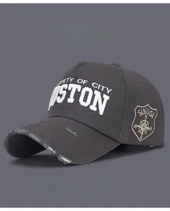 Detail of distressed brim and 3D Boston embroidery on vintage washed cotton baseball cap