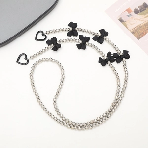 Silver bead crossbody phone chain strap with black bows and heart-shaped metal clasps