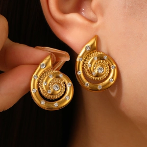 Elegant gold spiral starfish earrings with sparkling crystal studs for a beach vacation style