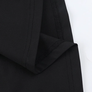 Close-up of double-needle stitching and high-quality hem finish on black lace jumpsuit
