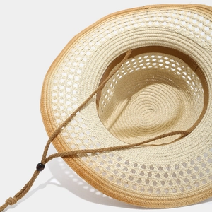 Western style straw cowboy hat with hollow brim and adjustable chin strap detail