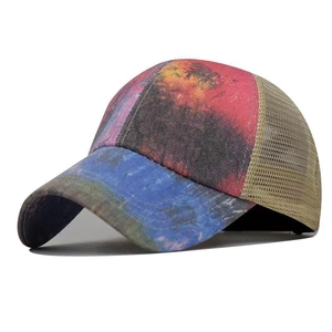 Close-up of tie-dye print patterns and breathable mesh fabric on back of baseball cap