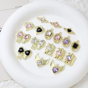 Selection of alloy heart and wing charms with zircon and pearls for DIY jewelry making