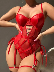 Close-up of red satin bodysuit with mesh panels, heart buckles and garter straps