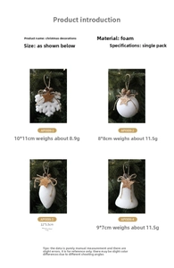 White foam Christmas ornaments with pine cones and stars hanging on a tree branch