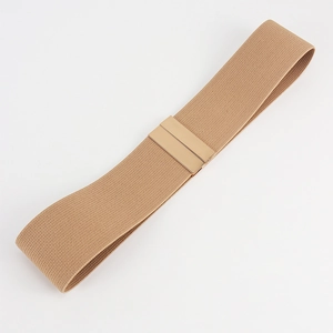 Detail of khaki elastic waist belt with textured weave and gold metallic buckle