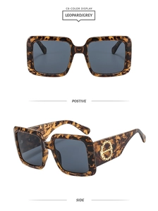 Detail of square leopard print sunglasses with grey lenses and gold side decoration