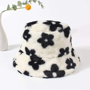 Winter plush bucket hat with black floral pattern and warm faux fur material for daily wear