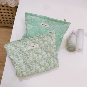 Green floral jacquard canvas makeup bags in two sizes with simple wish label