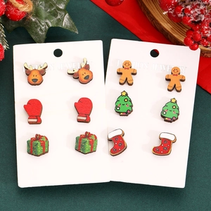 Festive 6-pair Christmas wooden stud earring set with reindeer and tree on green background