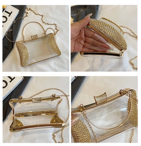 Detail of transparent acrylic evening clutch with gold metal frame and rhinestone trim